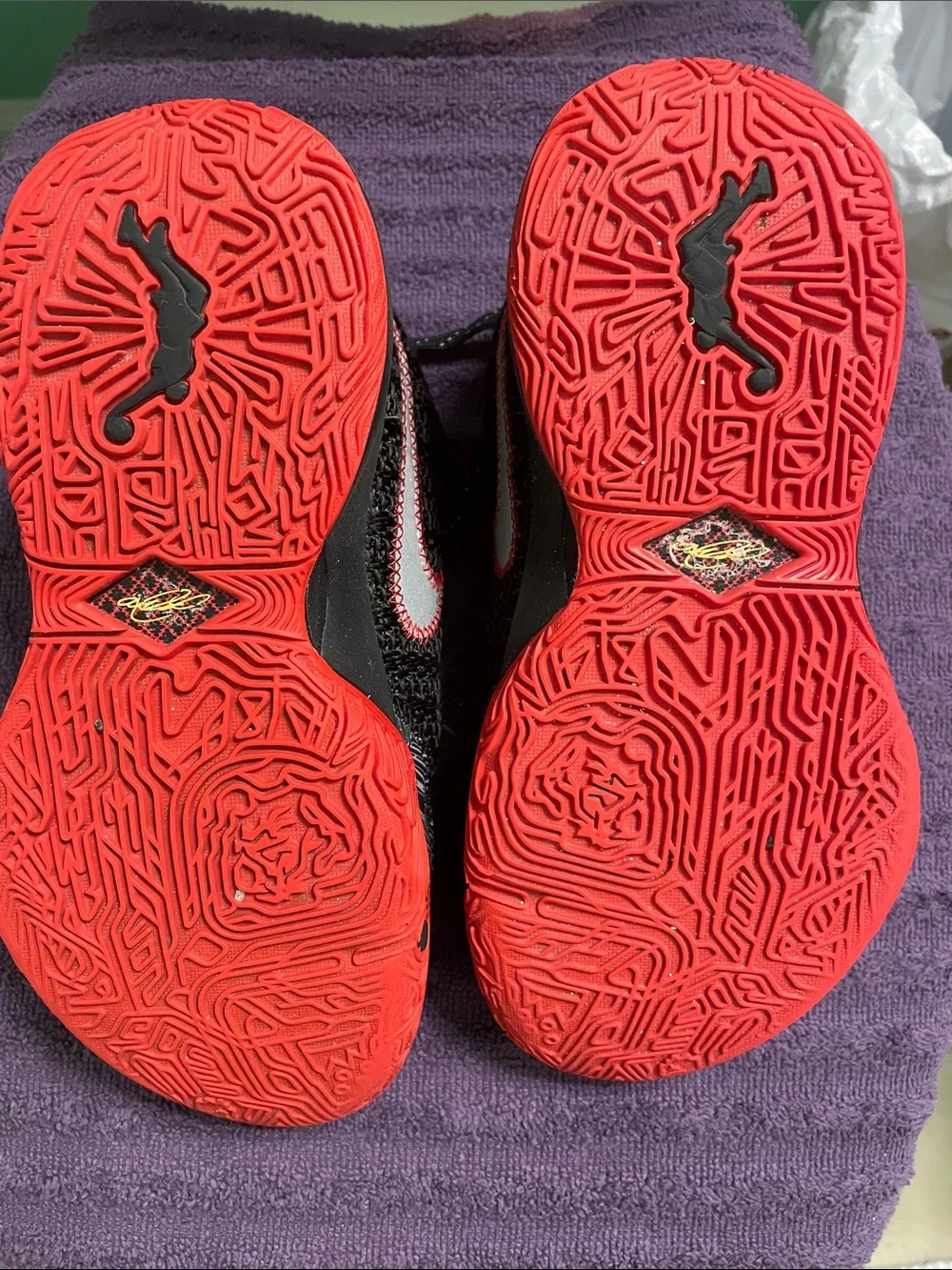 Nike Black Knit Sneakers with Gold Swoosh and Red Accents